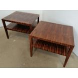 A pair of mid-century coromandel two-tier side tables, on tapering square supports. H64 W80 D70