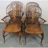 A set of four 19th century elm and beech Windsor wheelback chairs, on cabriole supports with