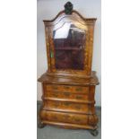 An 18th century Dutch walnut glazed cabinet on chest, with abundant floral marquetry inlay, the