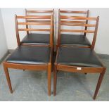 A set of four mid-century teak dining chairs by Victor Wilkins for G-Plan, with slatted backs and