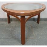 A mid-century teak ‘astro’ coffee table by Nathan, with glass insert, on turned supports with curved