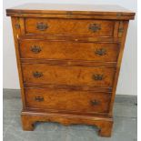 A Georgian style walnut Batcheler’s chest, the folding top above four graduated cock-beaded