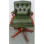 An antique style mahogany swivel desk chair, with height adjust, upholstered in green buttoned