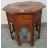 An early 20th century Anglo Indian teak octagonal table, strung with ebony and boxwood and featuring