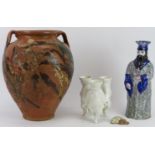 A group of European ceramic items. Comprising a glazed terracotta twin handled amphora, a ceramic