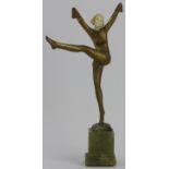 A Stefan Dakon gilt bronze, ivory and onyx female dancing figure, circa 1930. Marked Dakon to the