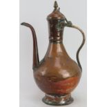 A Middle Eastern mixed metalwork Dallah coffee pot, 19th century. 33.5 cm height. Condition