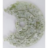 A Chinese celadon jade disc, 20th century. Carved in the style of Shang/Zhou dynasty period
