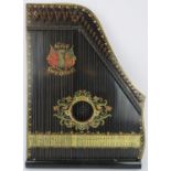 A Welsh harp by the Welsh Harp Zither Company. Made in Saxony. 55 cm length. Condition report: