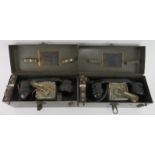 Two WWII military field telephone sets. (2 items) Boxes: 29 cm length. Condition report: Some wear