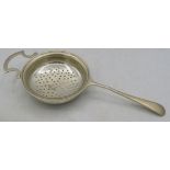 A silver tea strainer with handle, Birmingham 1945. Approx weight 1.7 troy oz/53 grams. Condition
