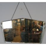 An Art Deco bevelled wall mirror with cast aluminium side detail. H38 W70 Condition report: No