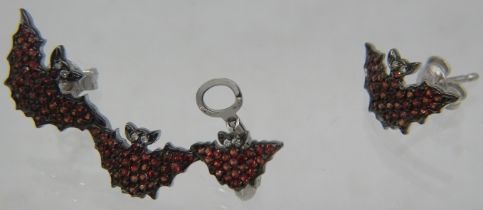 A Vanessa Pederzani from the 'Dark Kingdom' collection 'bat' ear cuff and earrings. Rubies approx