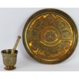 Two Middle Eastern engraved and inlaid brass wares, 20th century. Comprising a circular tray with