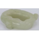 A Chinese pale celadon jade brush washer cup, early 20th century. Carved in the form of a furled