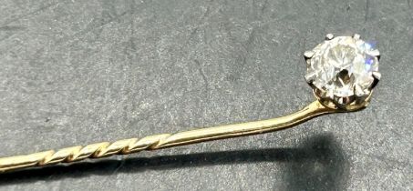 A round brilliant cut diamond stick pin. Approx 0.60 carats on yellow metal pin. Condition report: