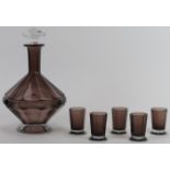 An Art Deco amethyst glass decanter with five matching shot glasses, early/mid 20th century. (6