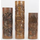 Three Chinese carved bamboo brush pots, 20th century. Decorated with a variety of figural scenes