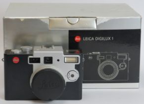 A Leica Digilux 1 7-21mm camera. Complete with box, carry strap and charger. Condition report: