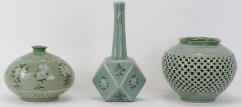 Three Korean celadon glazed porcelain vases, 20th century. Comprising a bottle vase with faceted