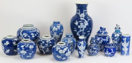 A large group of Chinese blue and white blossoming prunus pattern porcelain ginger jars and vases,