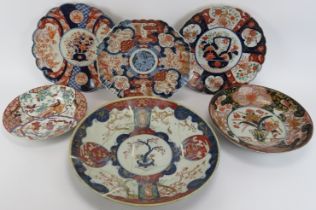 A group of six Japanese Imari and Arita plates and chargers, 18th century - early 20th century.