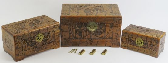 Three Chinese carved wood boxes, late 20th century. Comprising three graduated boxes carved to the