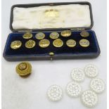 An assortment of mainly brass military buttons marked Jennens & Co, London in a Hawkes & Co,