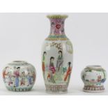 Two Chinese famille rose polychrome painted porcelain vases and a ginger jar, 20th century. Each