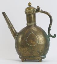 A Mughal Indian inscribed brass metalwork ewer, 19th century or earlier. Of bulbous form with a