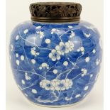 A large Chinese blue and white porcelain ginger jar and openwork carved wood cover, 19th century.