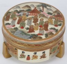 A Japanese satsuma box and cover, Meiji period. Of cylindrical form, supported on three feet and