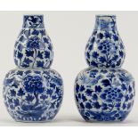 Two Chinese blue and white porcelain double gourd vases, 19th century. Underglaze blue four