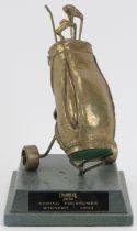 Local interest: A modern cast metal Cranbrook Golf Club trophy depicting a golf bag and trolley with