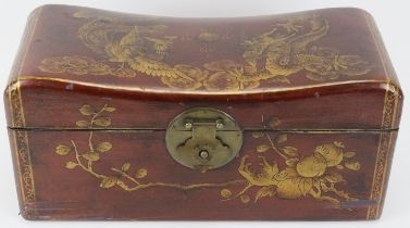 A Chinese gilt lacquered leather bound combined box chest and pillow rest, 20th century. Modelled