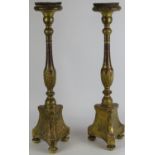 A European Roman Catholic ecclesiastical pair of gilt gesso carved wood altar candlesticks, 19th