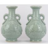 A pair of Chinese celadon glazed porcelain twin handled vases, late 20th century.