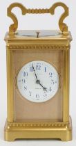 An Irish Racine & Co gilt brass repeater carriage clock, late 19th century. With four bevelled glass