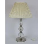 A Laura Ashley glass and chromed metal table lamp and shade. 58 cm total height. Condition report: