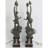 A pair of neo-classical cast spelter figural table lamps, early 20th century. Both spelter figures
