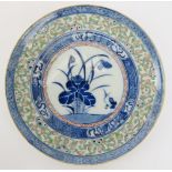 A Chinese polychrome enamelled blue and white porcelain rice grain pattern dish, late 19th/early