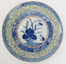 A Chinese polychrome enamelled blue and white porcelain rice grain pattern dish, late 19th/early