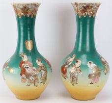 A large pair of Japanese satsuma porcelain vases, 20th century. Both painted with gilt highlighted