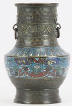 A Chinese champlevé enamelled bronze twin handled vase, 19th century. With bands of archaistic