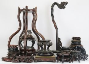 A large variety of Chinese carved hardwood stands, 20th century. (Quantity) 69 cm tallest height.