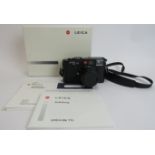 A Leica M6 TTL black chrome finish body camera with Leica 50mm F2 Summicron M black lens and B+W