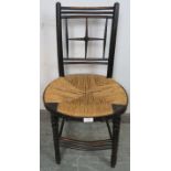 A 19th century Arts & Crafts ebonised beech Sussex chair by Morris & Co, the geometric back spindles