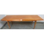 A mid-century teak rectangular coffee table by Gordon Russell, having a chamfered and shaped edge,