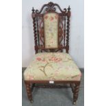 A Victorian rosewood occasional chair, having onion finials, barley twist uprights and scroll