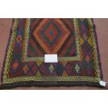 A 20th century Kilim rug, colourful, central diamond motifs and in good condition. 250cm x 80cm.